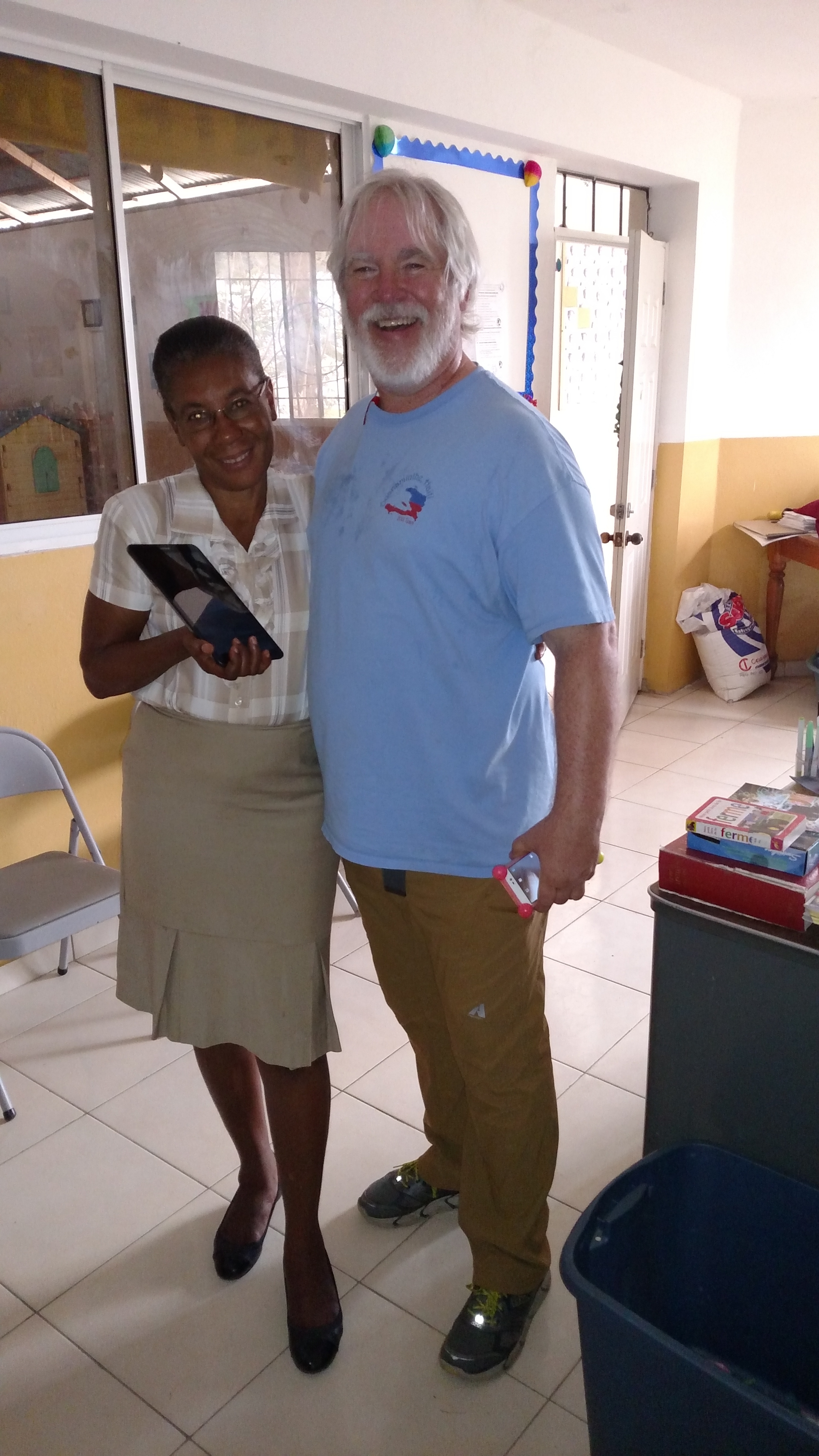 Madam Colonyo was the first teacher at Institution Univers. One teacher, 30 kids in one room. By the time I started coming to the school, she was the Principal of the Kindergarten building. Kids ages 3-5 (300) were under her team of teachers. After building a friendship with her over a few years, I surprised her with a tablet. She was so excited, since their was WIFI at the school.