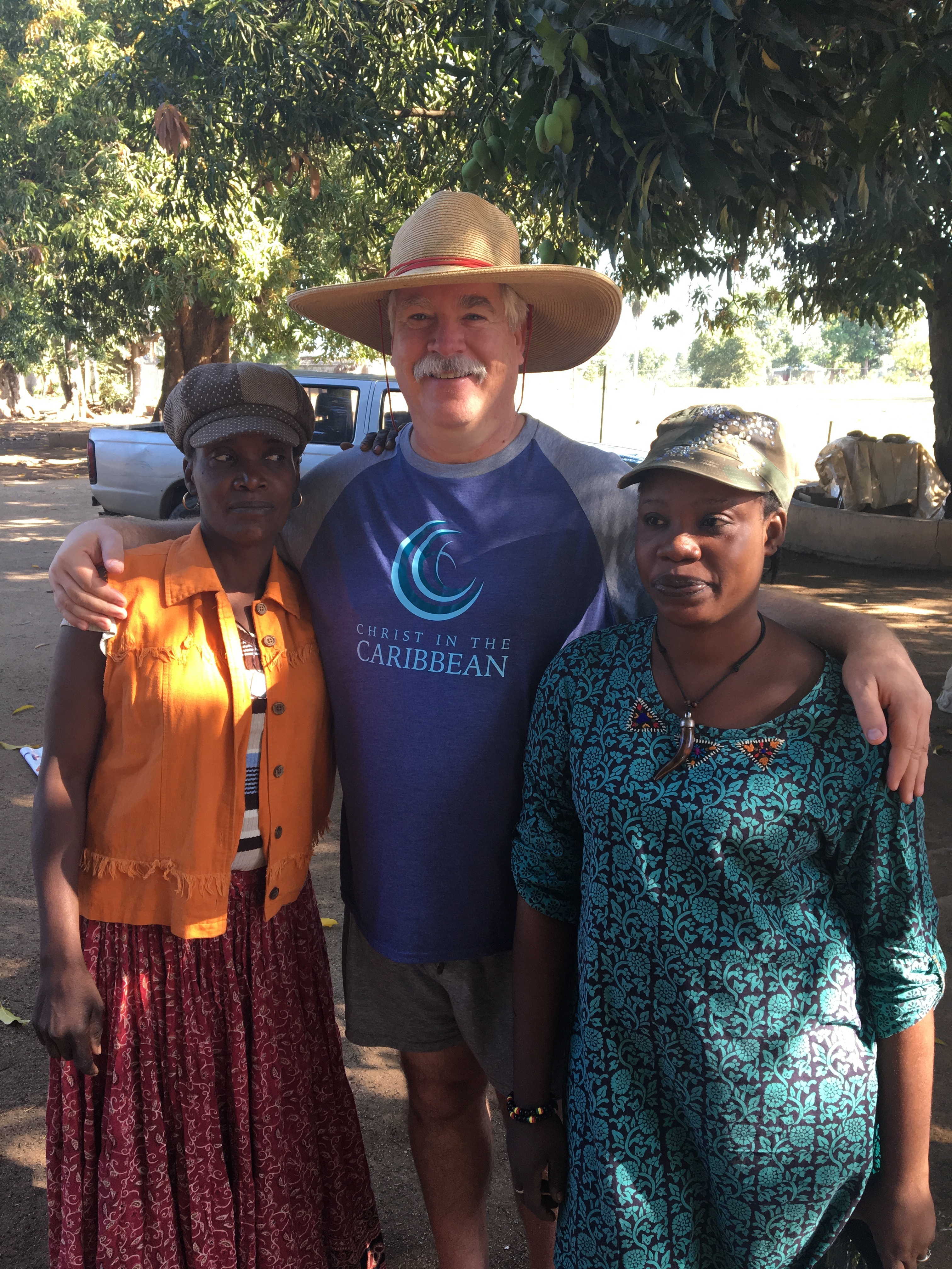 Michael with his two favorite art dealers. Five or six families would set up at the school and wait for us to return from the field so we can look over the art that they had to sell. Roselyn (yellow) was unable to speak well, so her daughter (or son some years) would come to help facilitate the negotiations. They always had at least one person in the group who could speak English very well. We loved catching up with them each year.