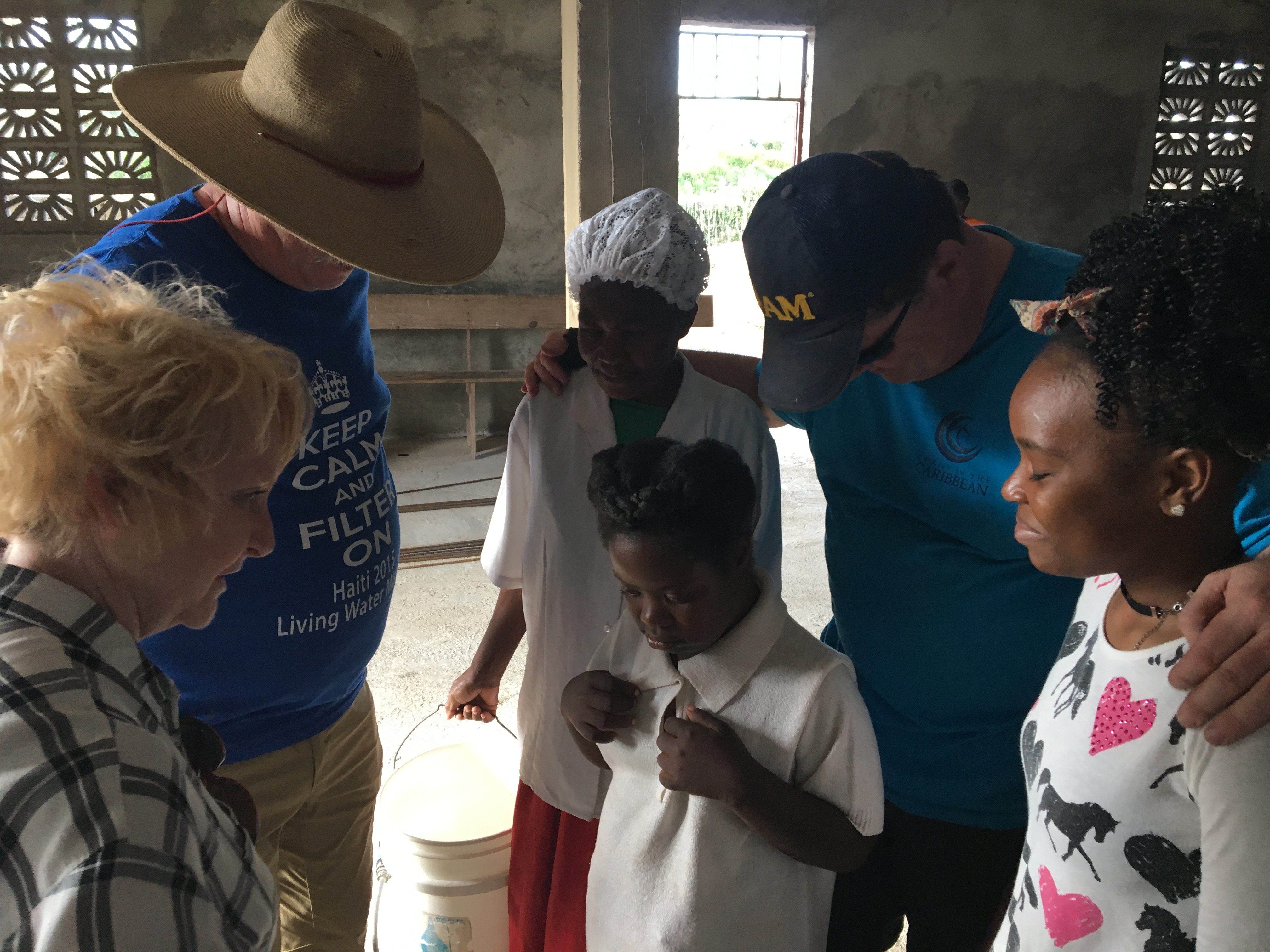 "Precious" (young girl in the center) is prayed for on her mother's request. She was not expected to survive very long after birth, yet here she is. We love when villagers ask us to pray with them.