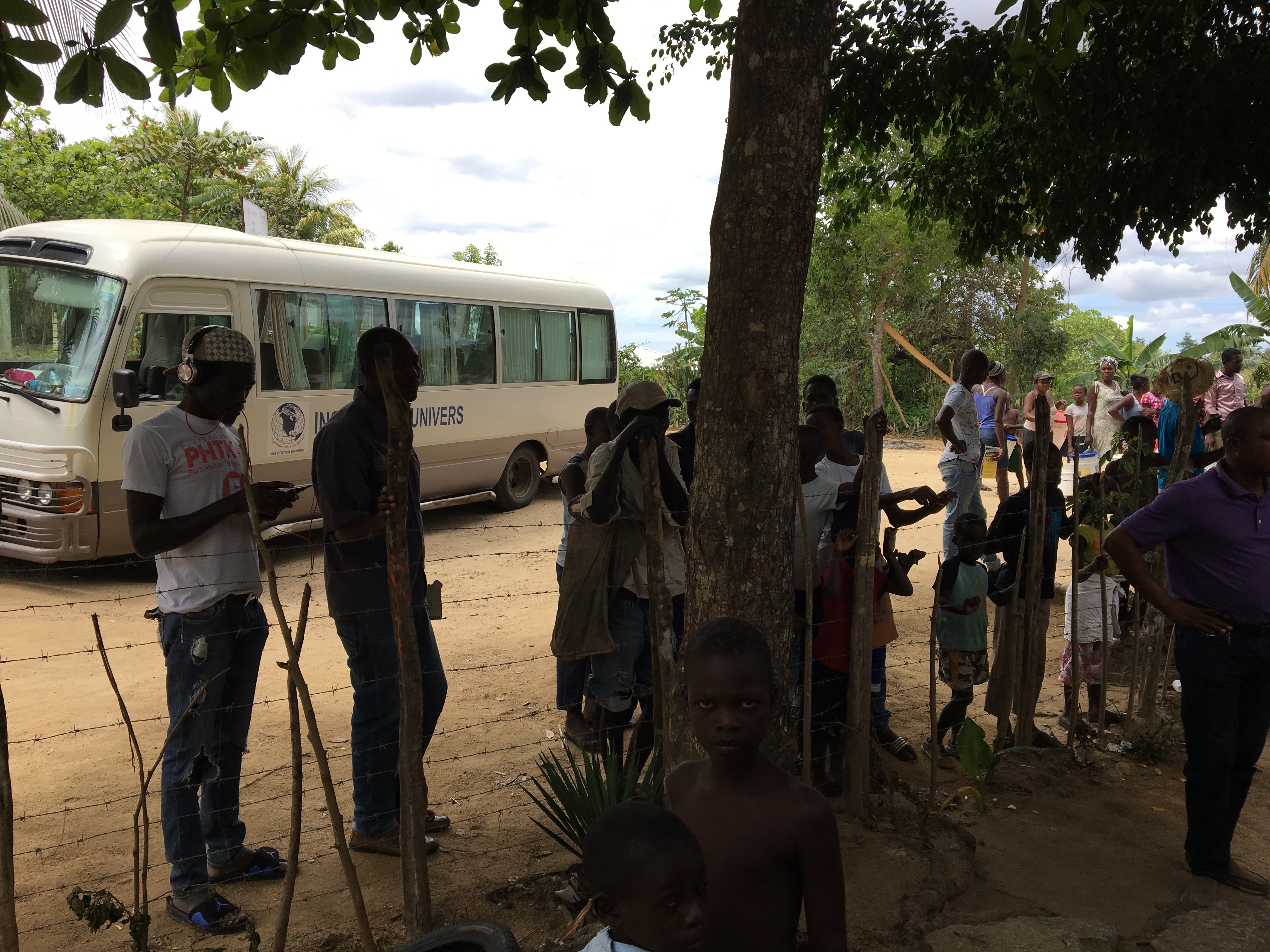 People starting to line up to see what our team was doing in their village.